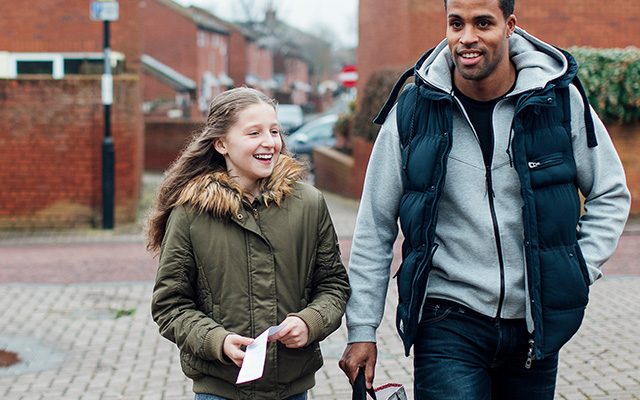 foster child with foster dad walking
