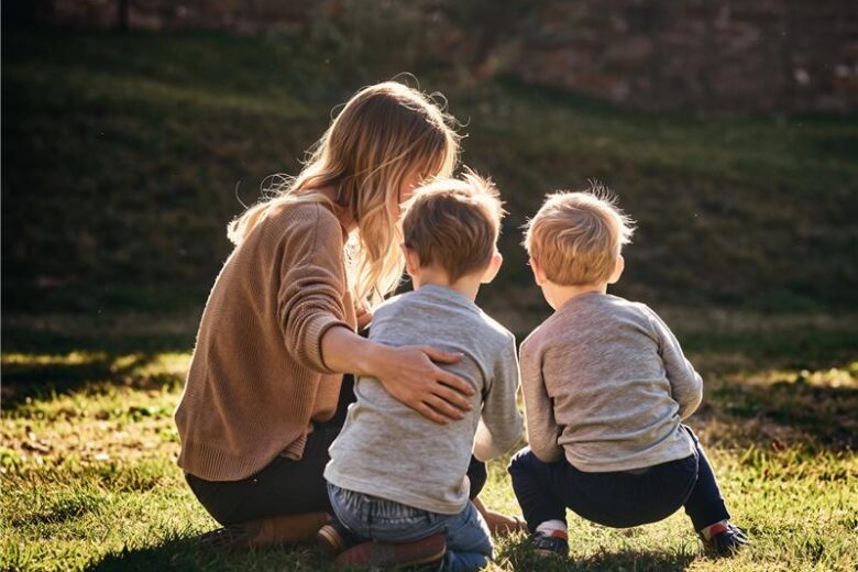 Mother playing with two boys
